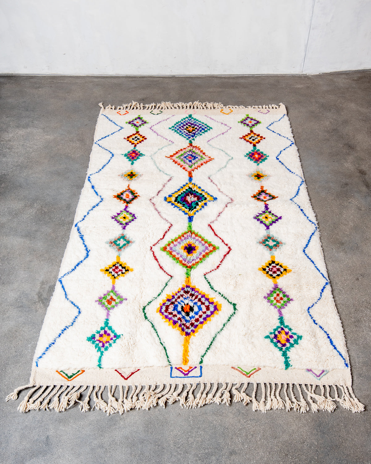 Modern, designer, handcrafted Berber rug from Morocco. Beniourain carpet with beautiful colours and patterns and fluffy wool texture.